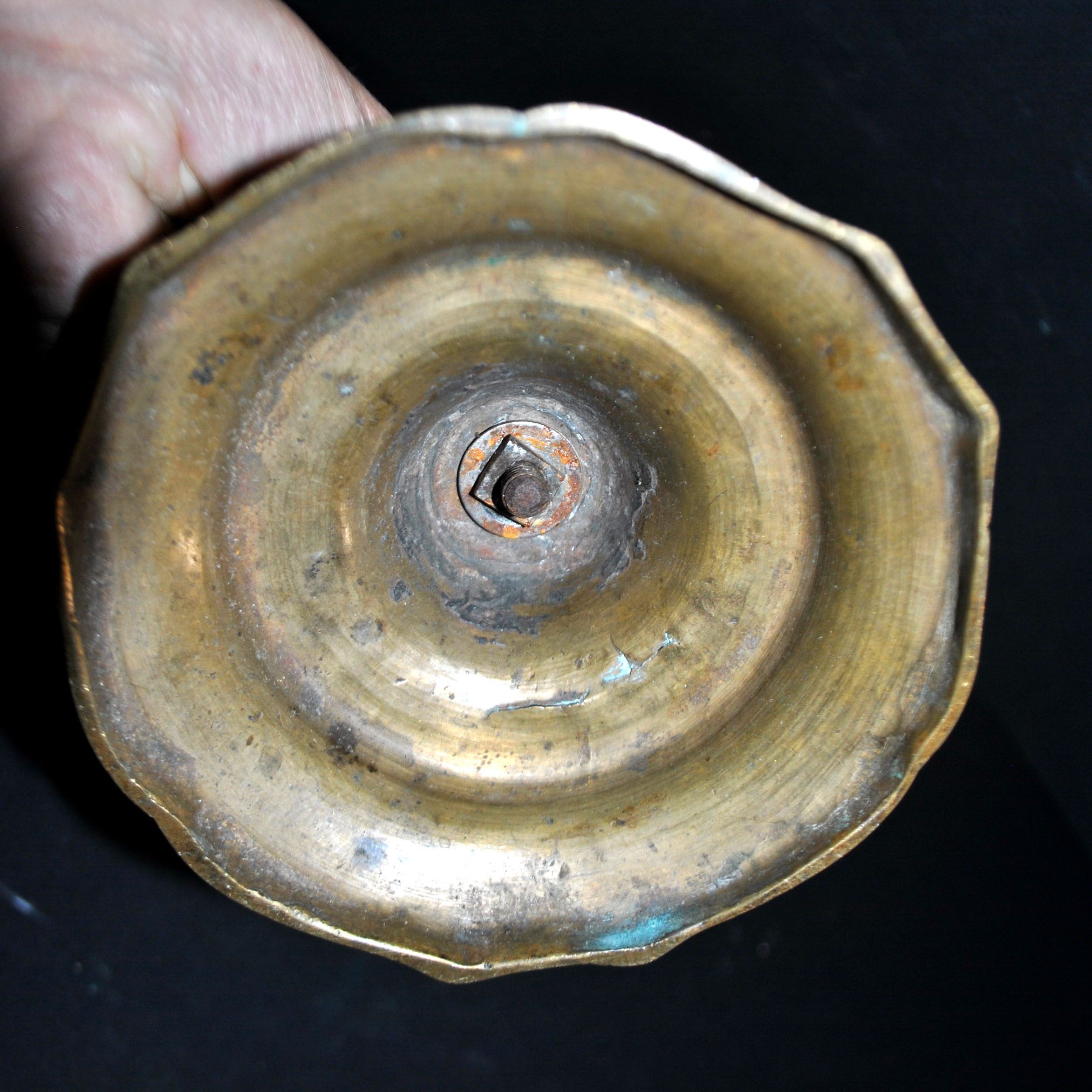 Antique candle holder, carved in bronze, 18th century.