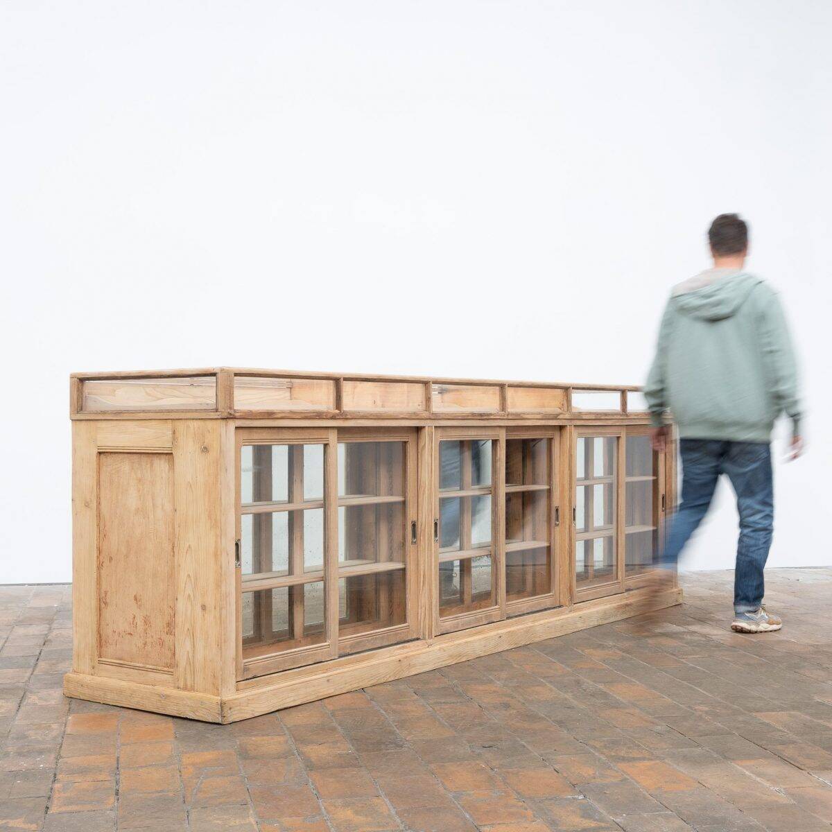 Old glass-fronted pine trade counter - early 20th century