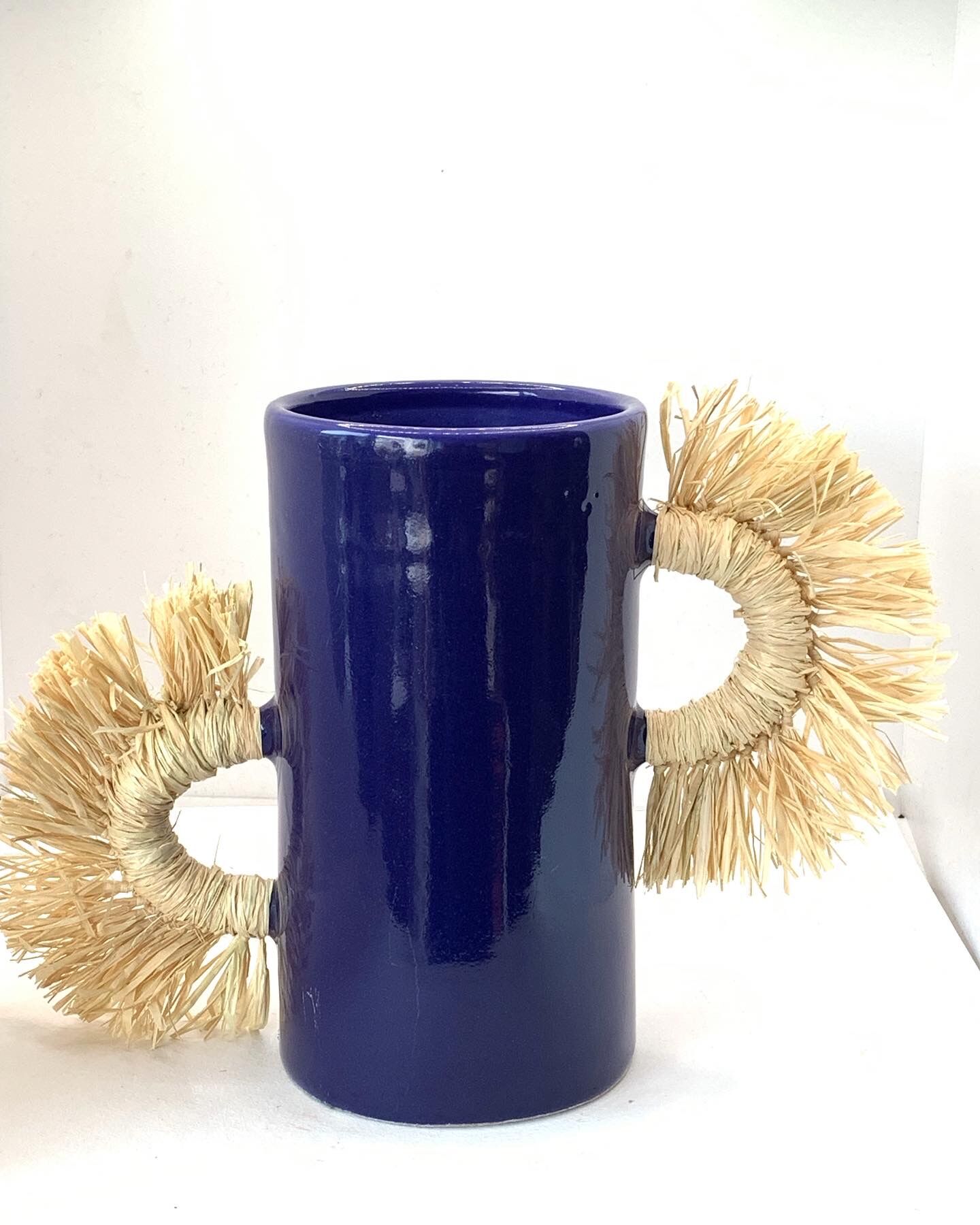 Tube vase with raffia handles