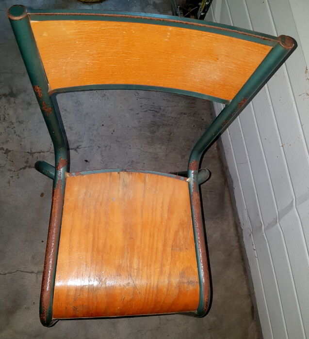 Old science school chair in tube
