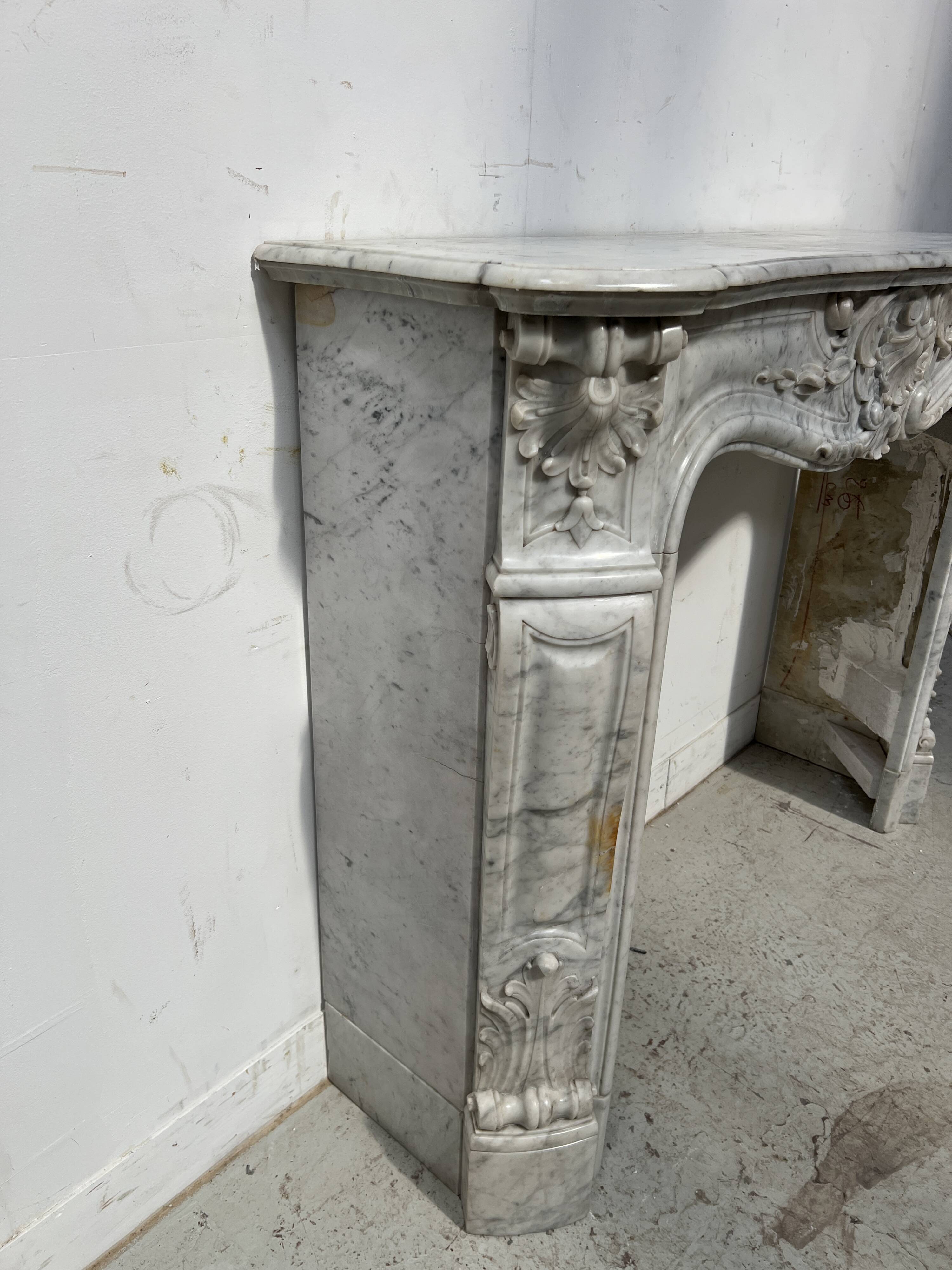 Louis XV style white Carrara marble fireplace, 19th century.