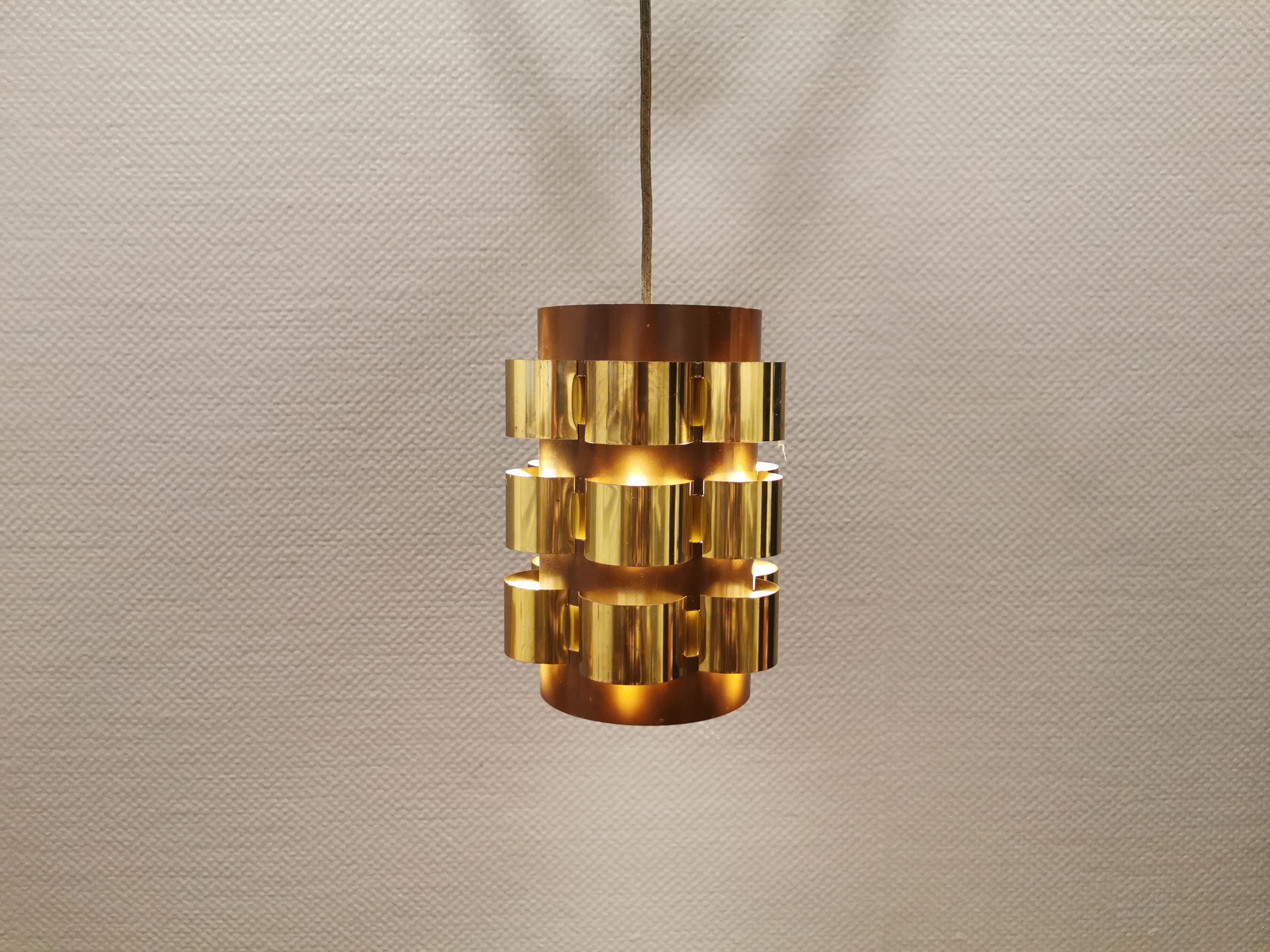 Danish hanging lamp from the 70s, in thin cut metal.