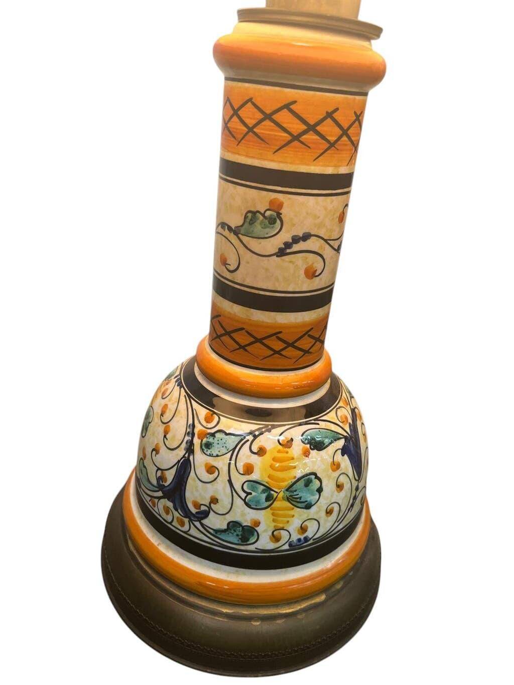 Vintage orange Portuguese table lamp with a ceramic base.