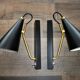 Pair of modernist sconces in black and gold metal