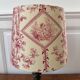 Empire style lamp with a toile de Jouy shade.