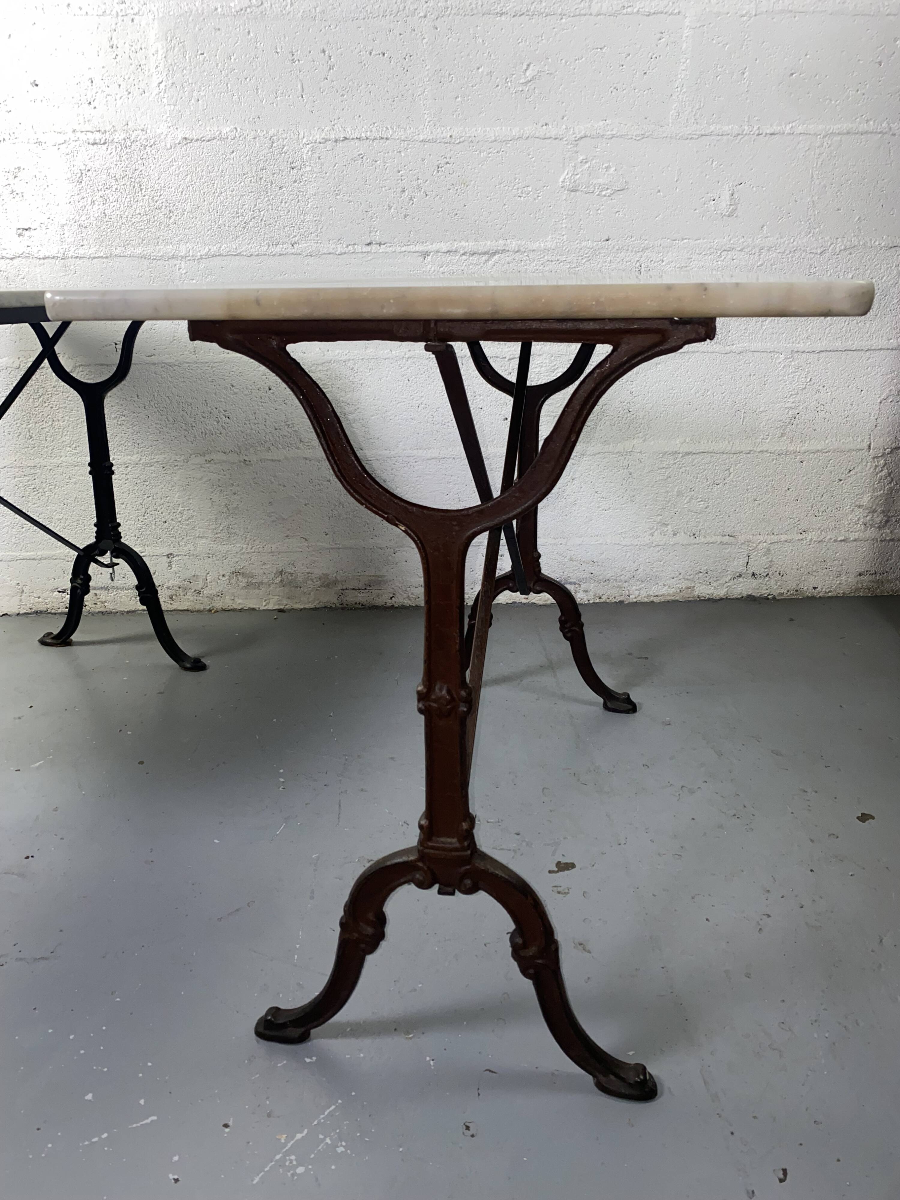 Set of two bistro tables in marble and wrought iron