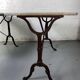 Set of two bistro tables in marble and wrought iron