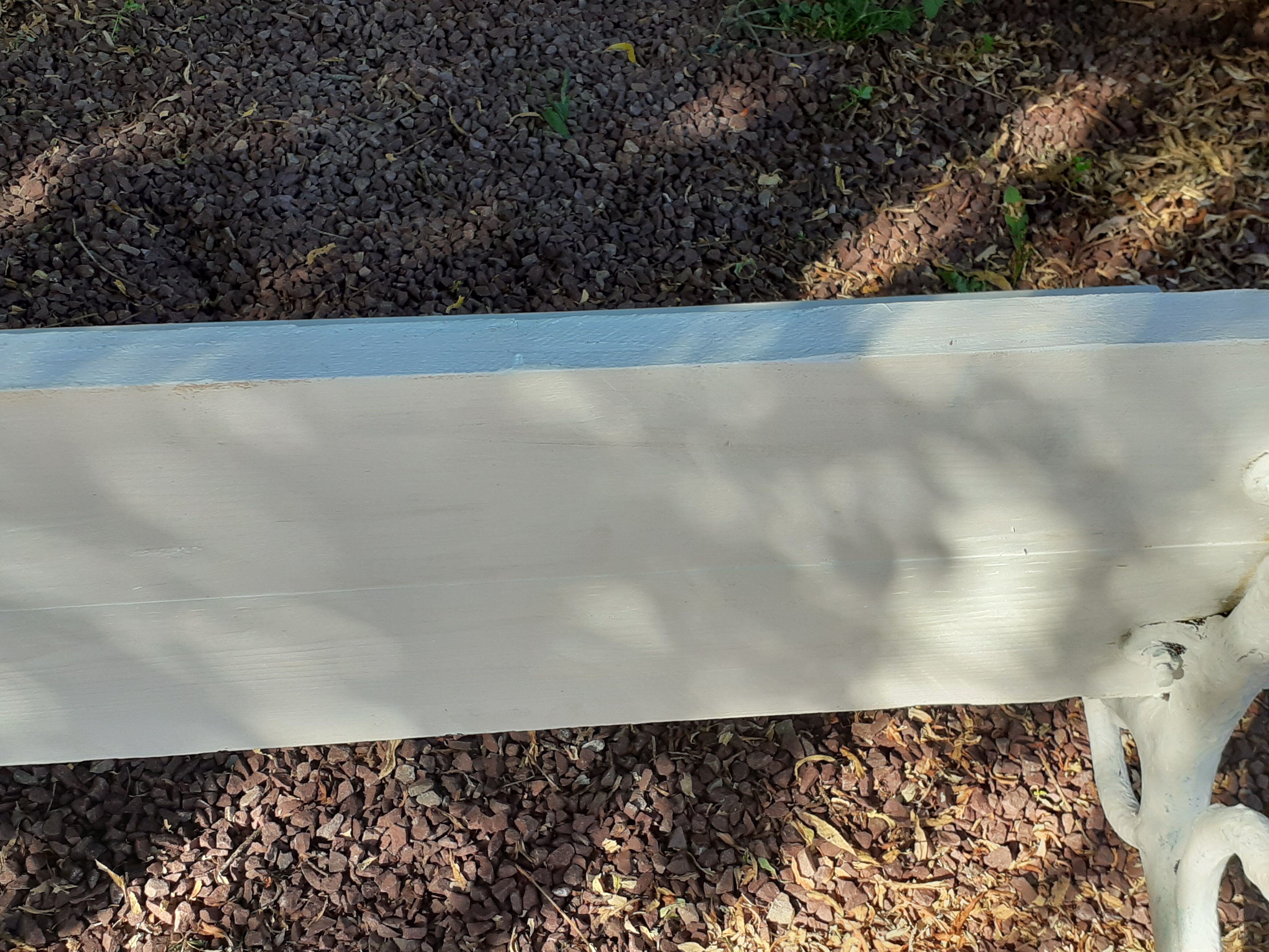 Old garden bench with cast iron feet and wooden planks