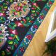 Romanian floral runner rug on blue background