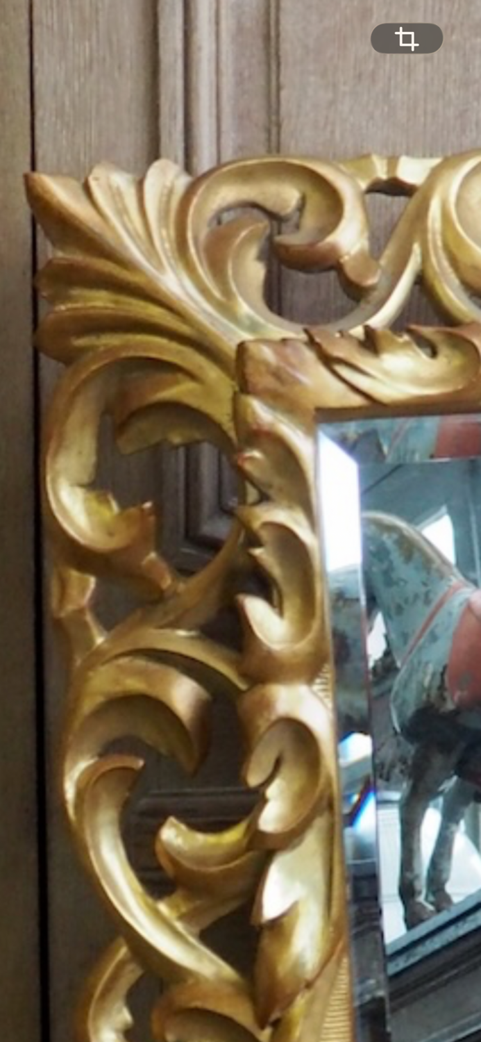 Superb mirror from the late 19th century, carved wood with gilded stucco.
