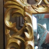 Superb mirror from the late 19th century, carved wood with gilded stucco.