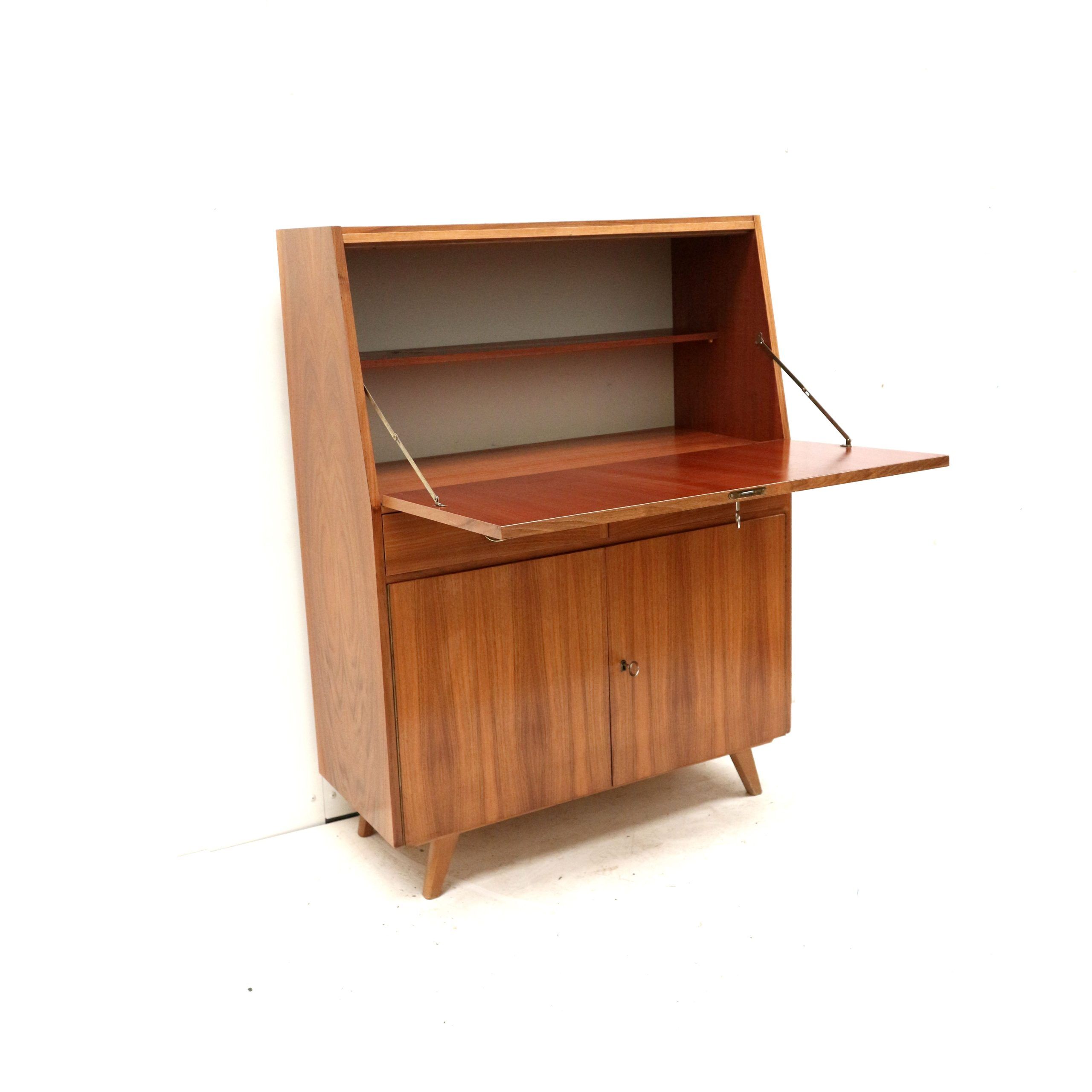 Vintage secretary with drawers, drop-down and doors from the 1960s.
