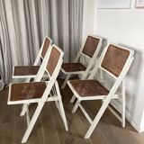 4 folding chairs with wicker seating