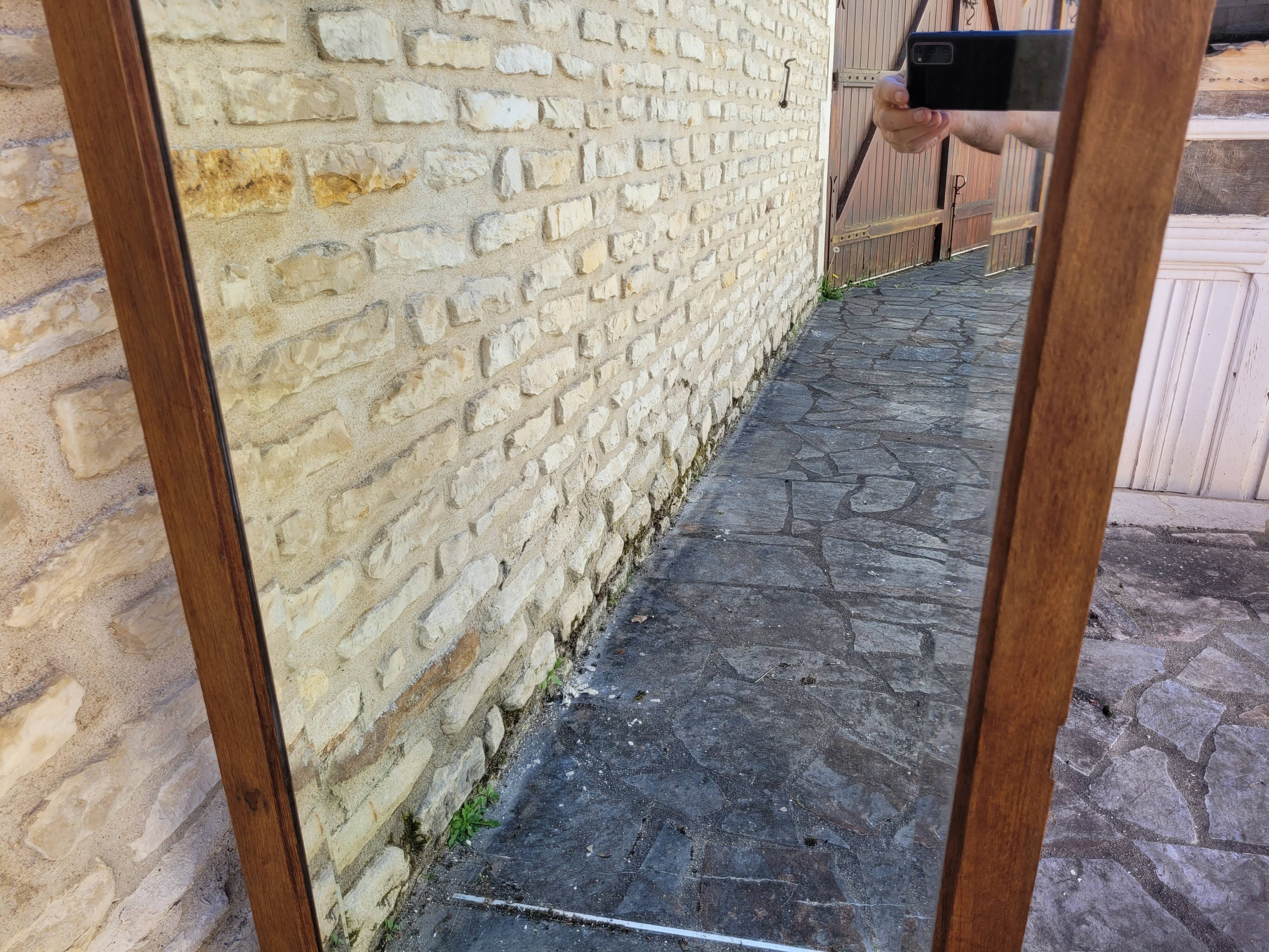 Art Deco oak mirror with bevelled glass from the 1930s.