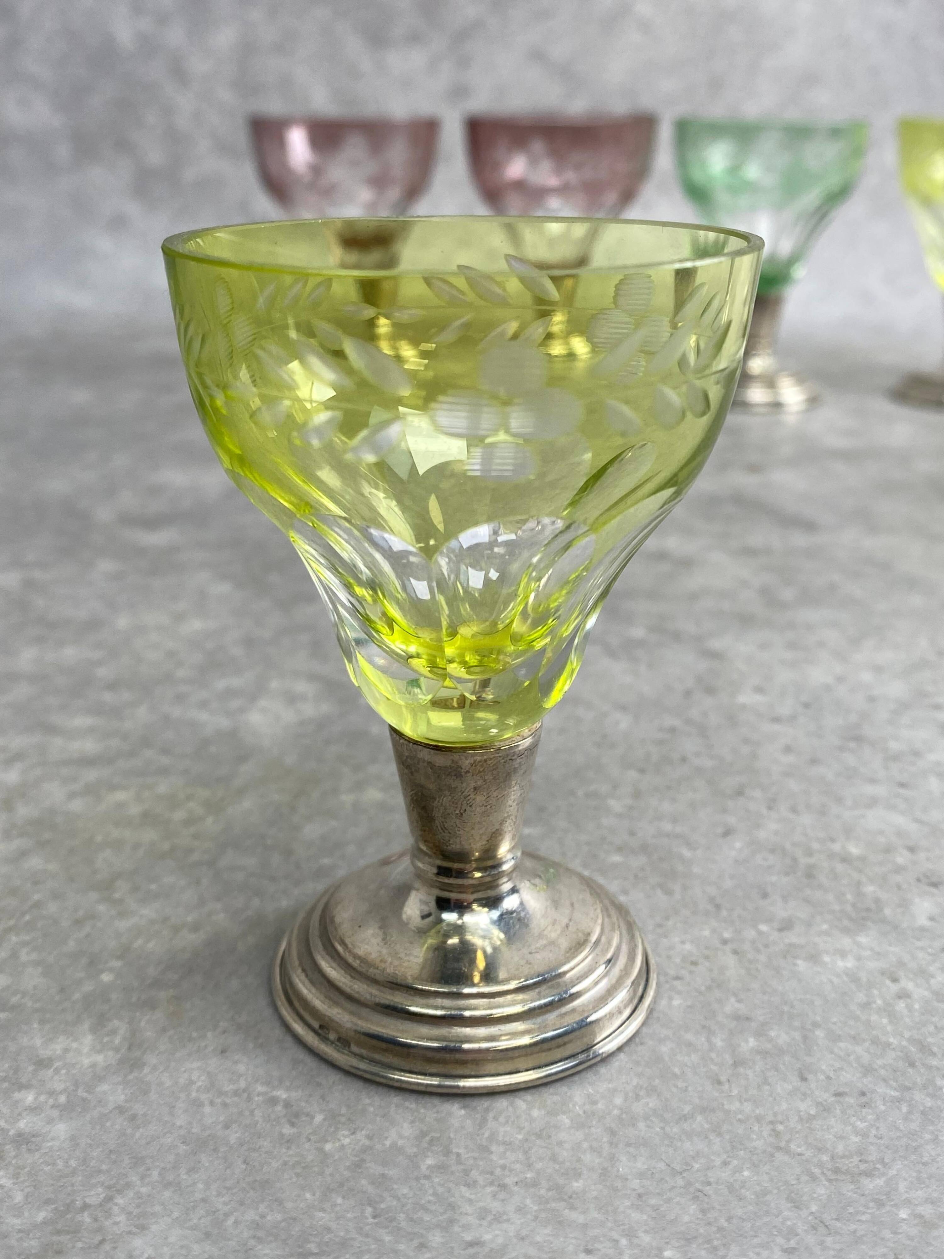 Set of 6 coloured stemmed glasses on silver stems.