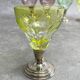 Set of 6 coloured stemmed glasses on silver stems.