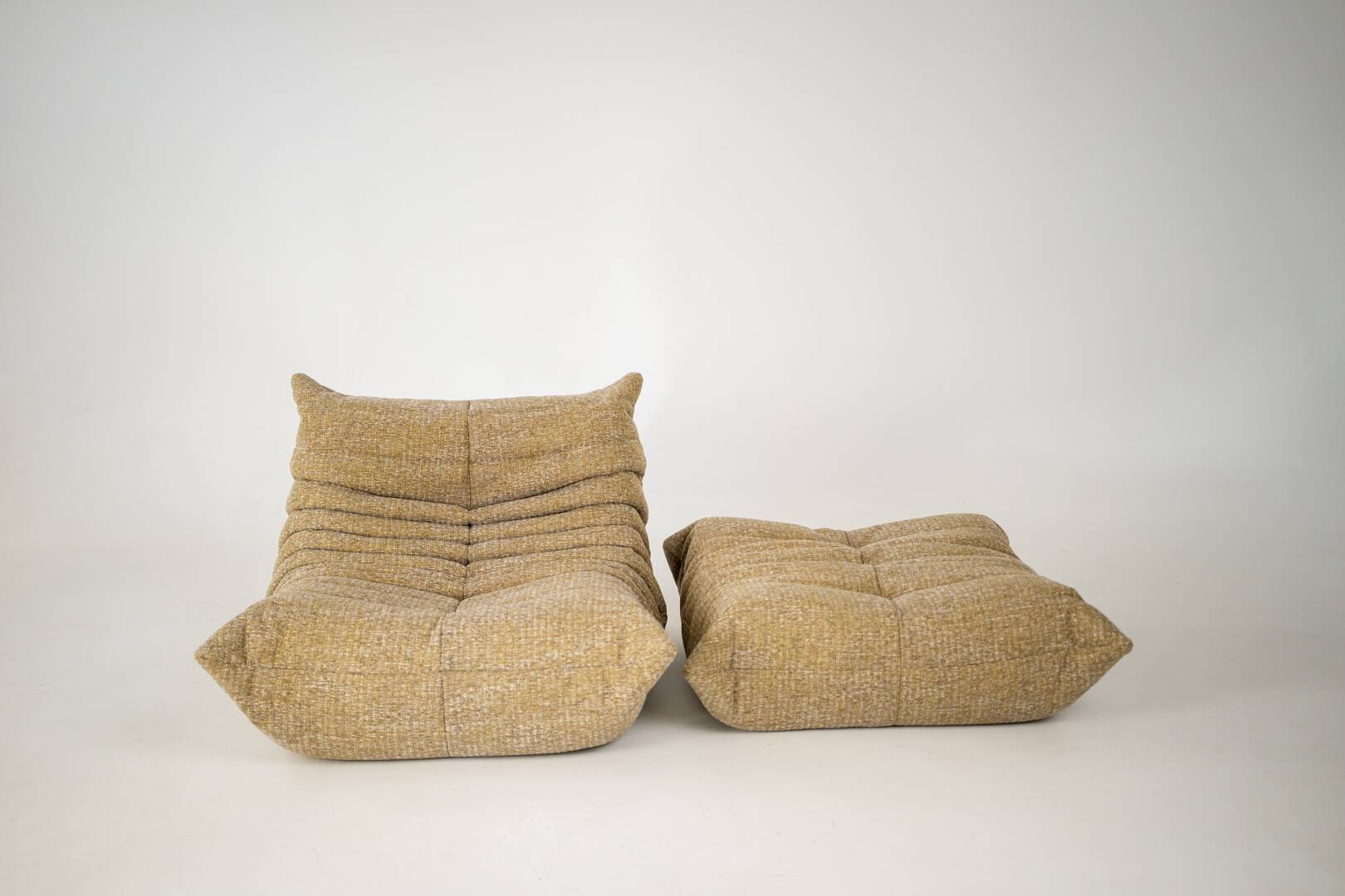 Togo set of launge chair and pouf in caramel loop