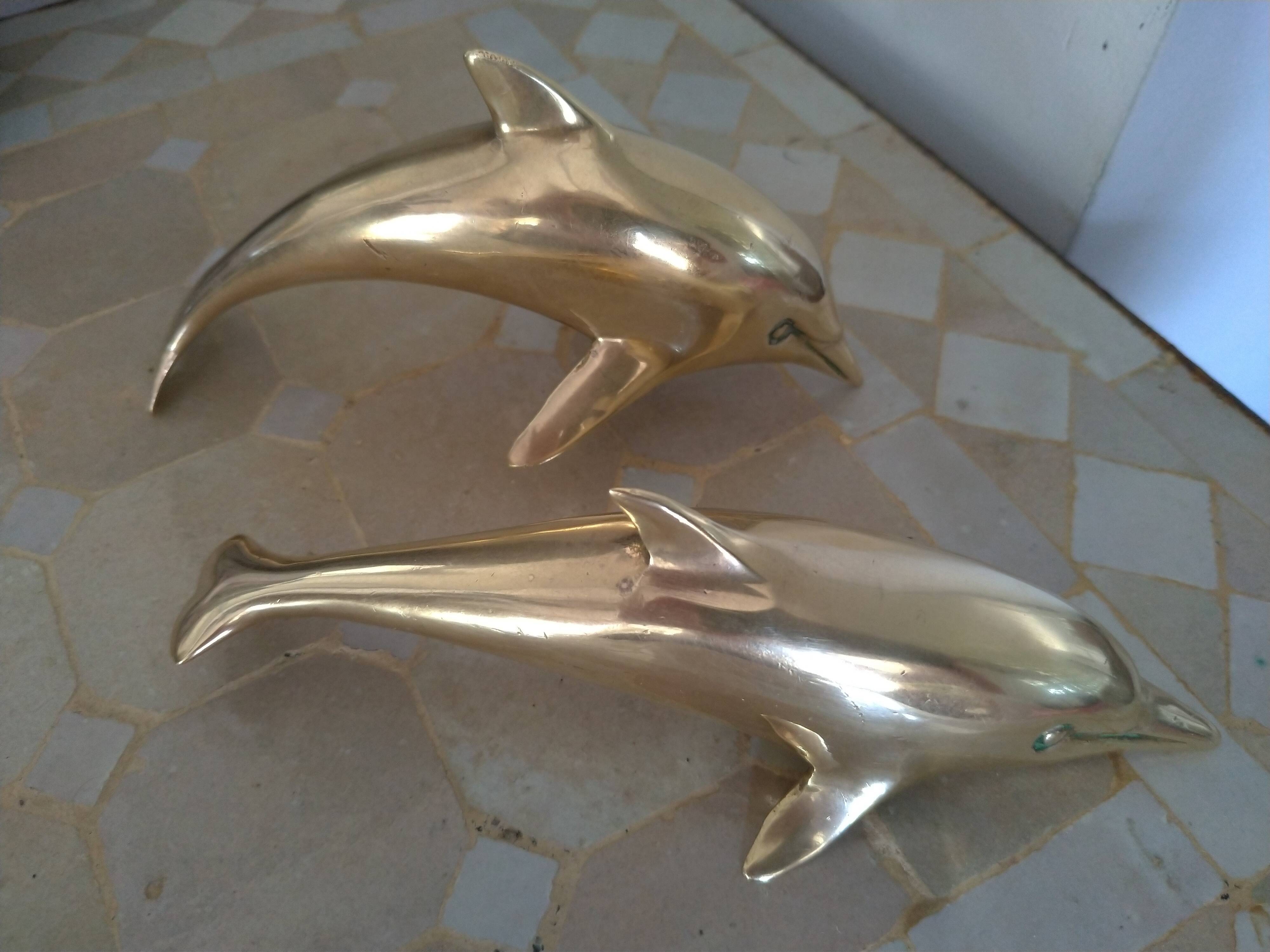 Brass dolphins