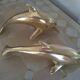 Brass dolphins