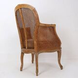 Louis XV style carved armchair with double sided cane work on the side panels