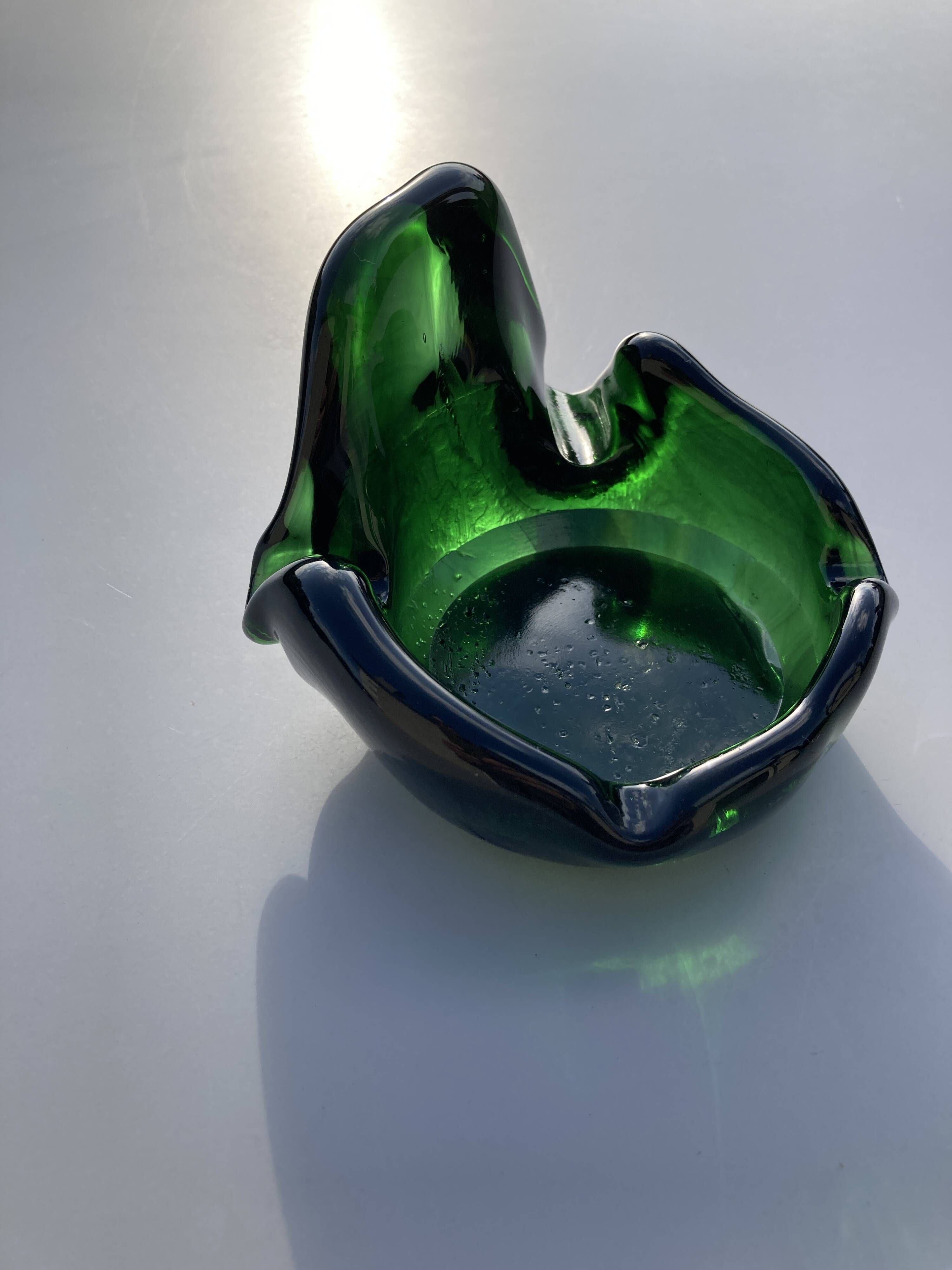 Sculptural ashtray in emerald green glass