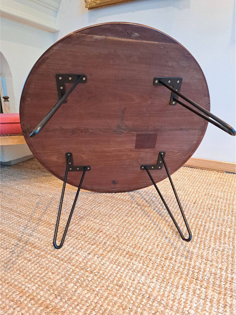 Round coffee table with mahogany wood top