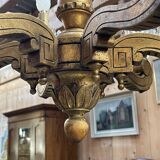 Golden wooden chandelier with crystal pendants from the 19th century.