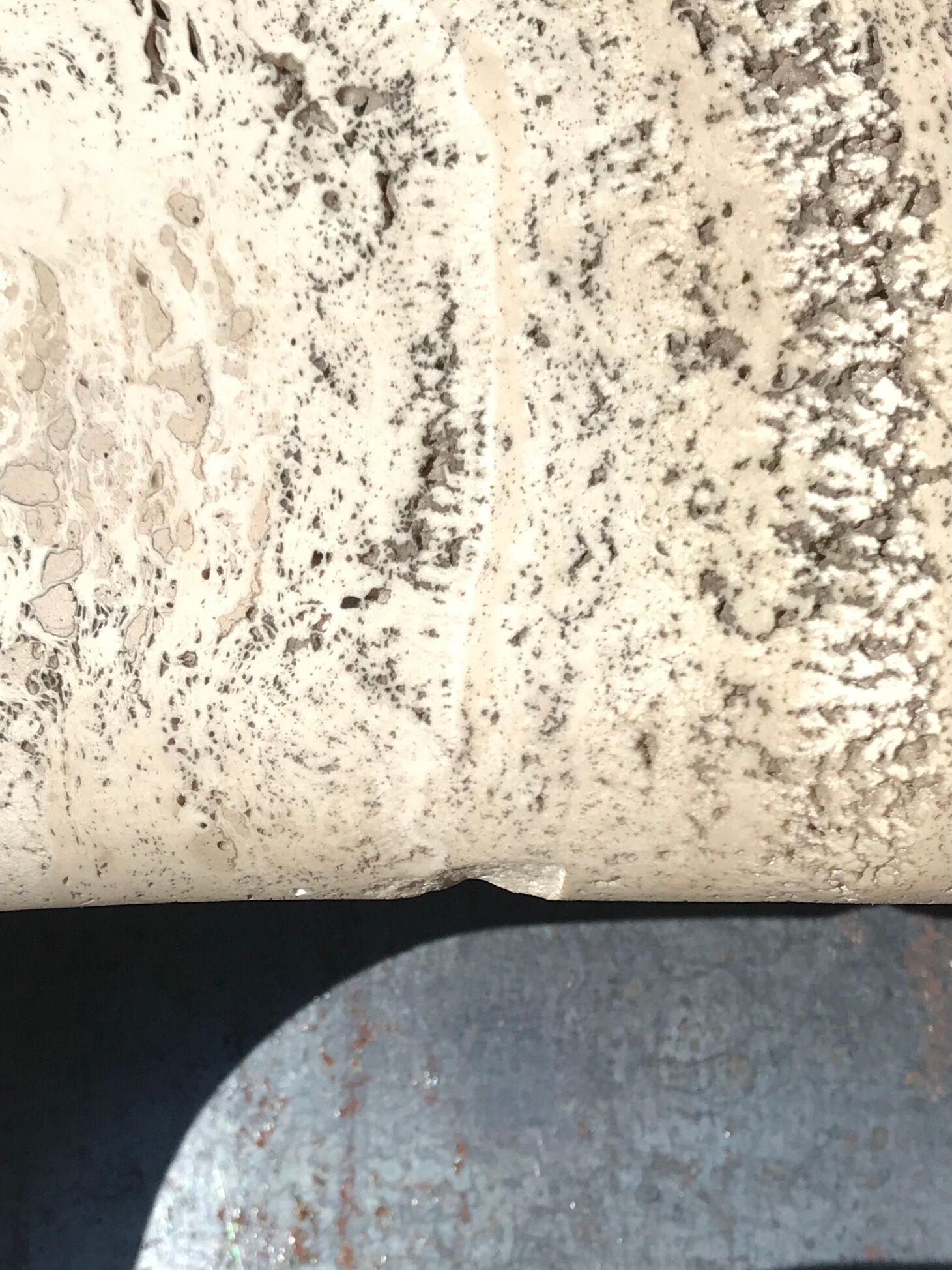 Sculptural travertine coffee table