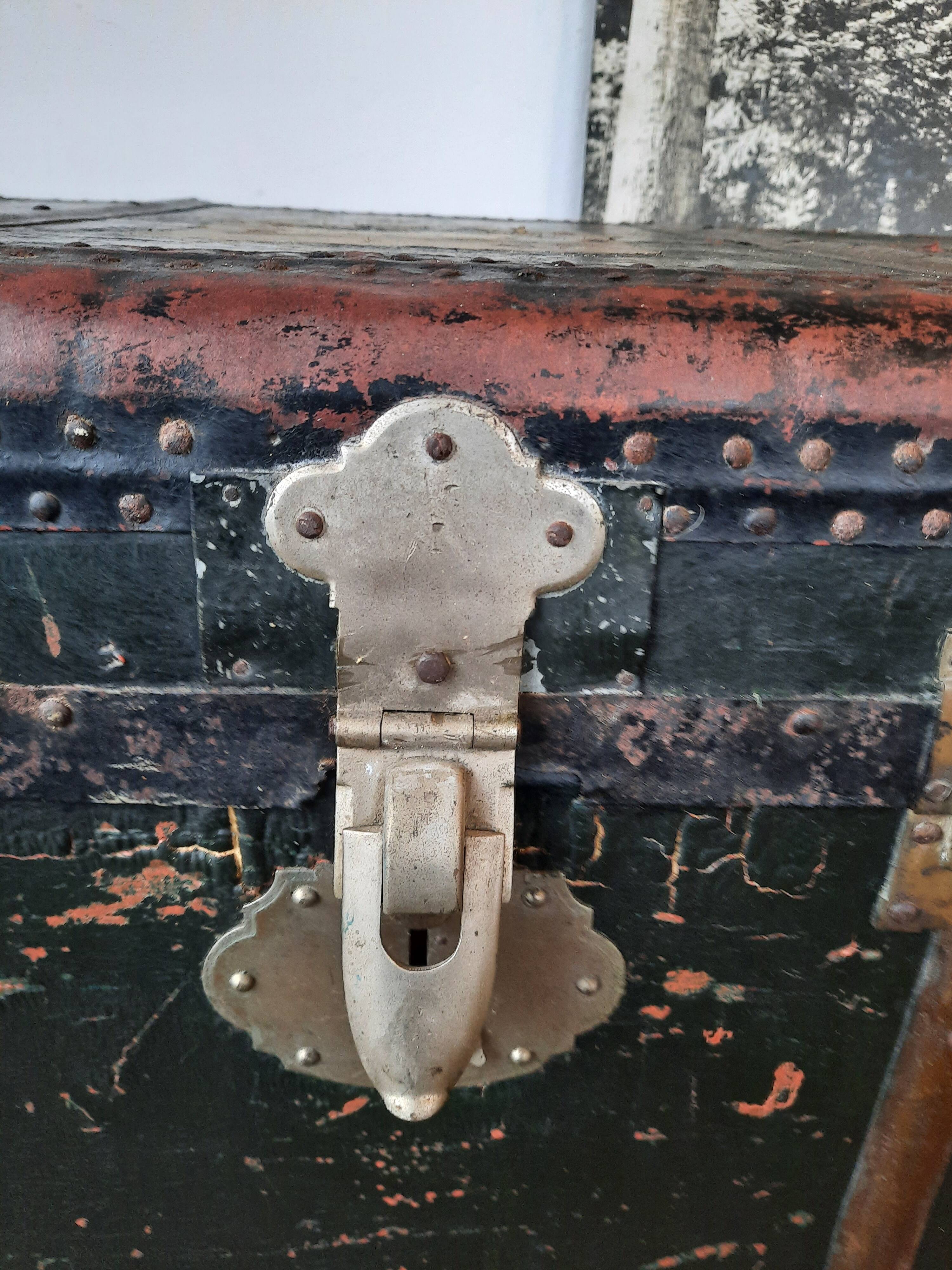 Old and large travel trunk, brass-plated corners