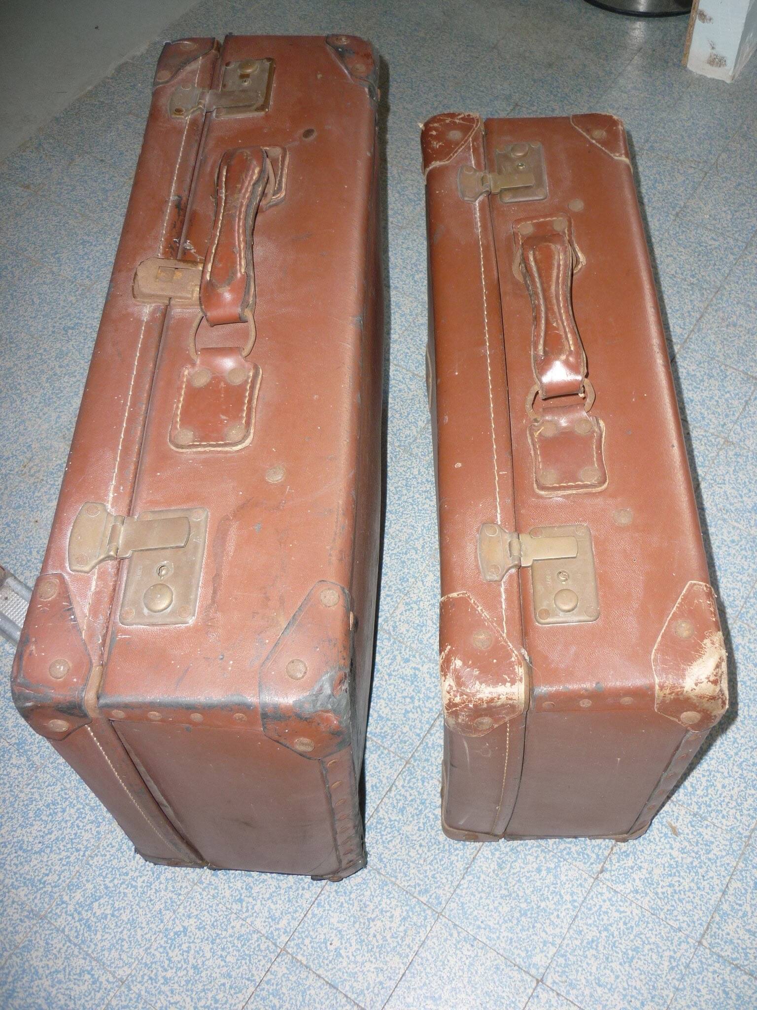 Pair of red suitcases from the 1950s