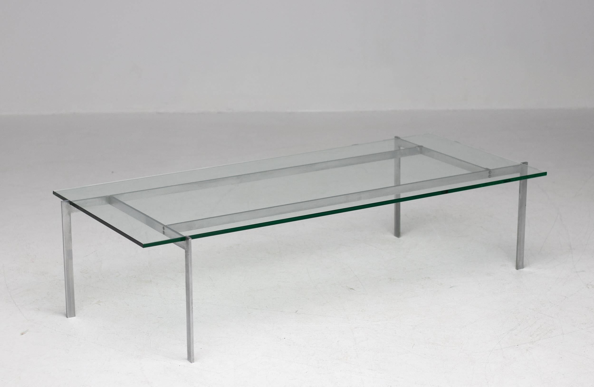 Architectural rectangular coffee table in steel and glass.