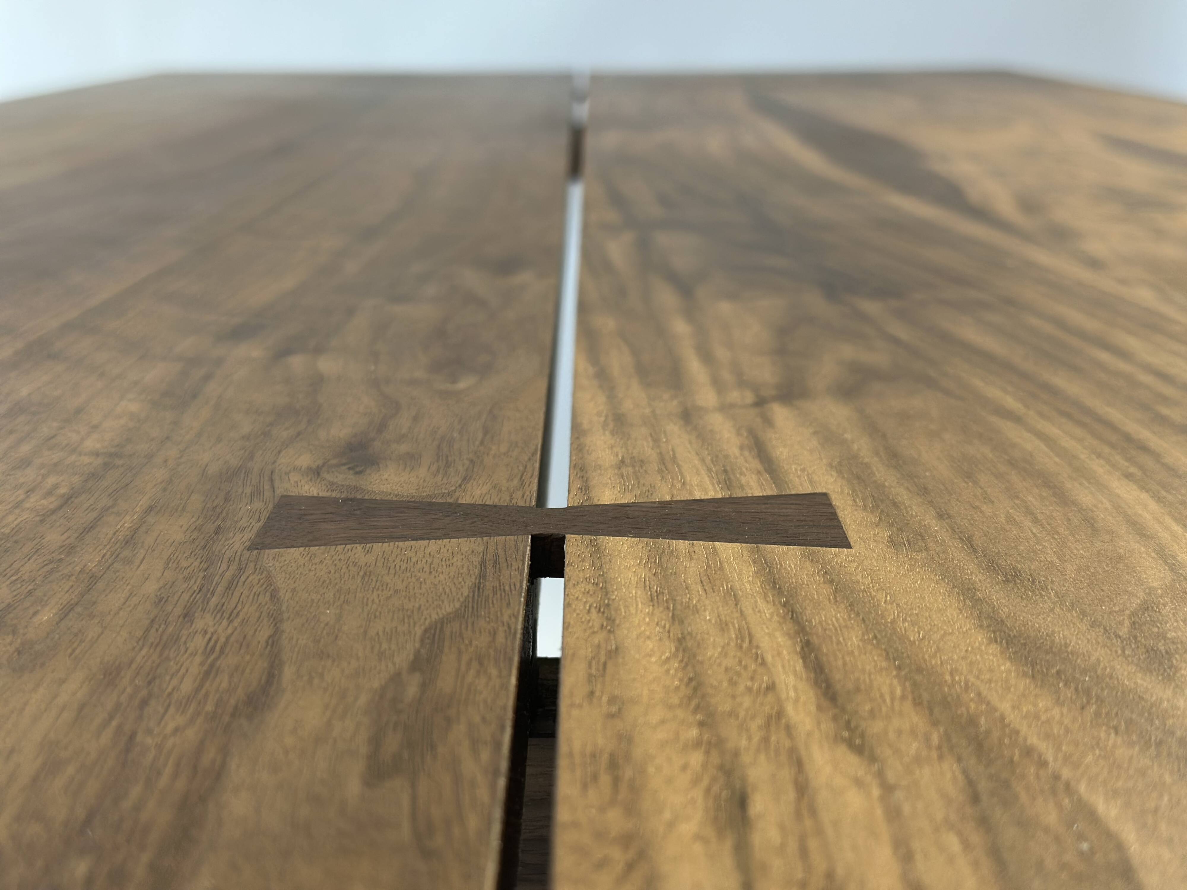Exceptional dining table in solid walnut.