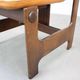 Vintage German sculptural chair from the 1970s in wood with orange faux leather.