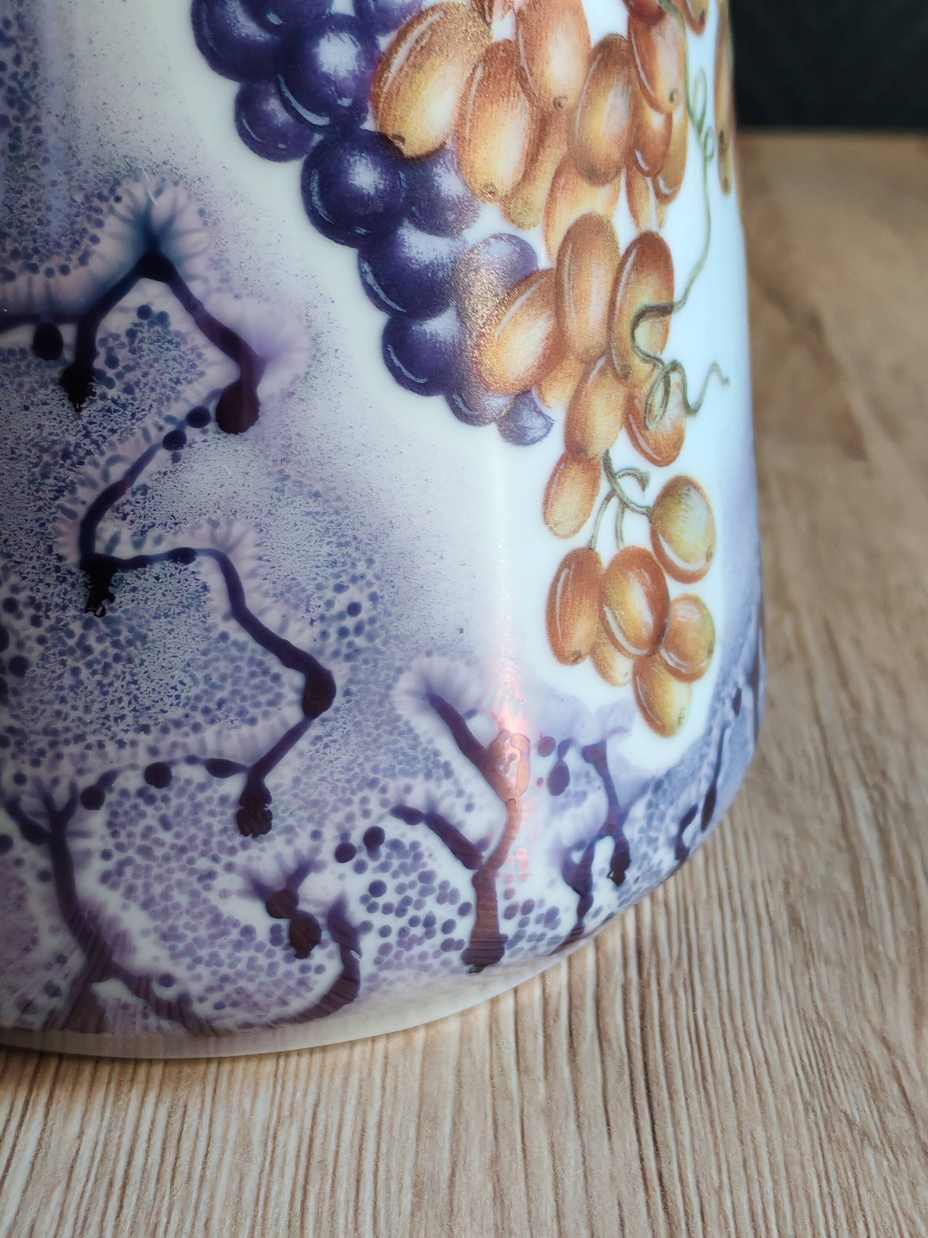 Vintage porcelain pitcher Lusseray France, decorated with grape clusters.