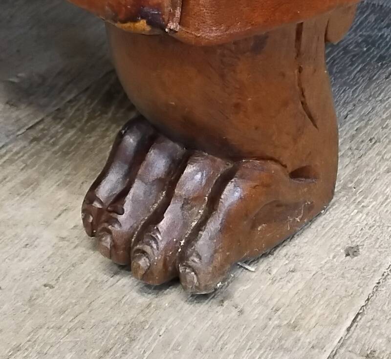Club chair with moustache back and lion feet.