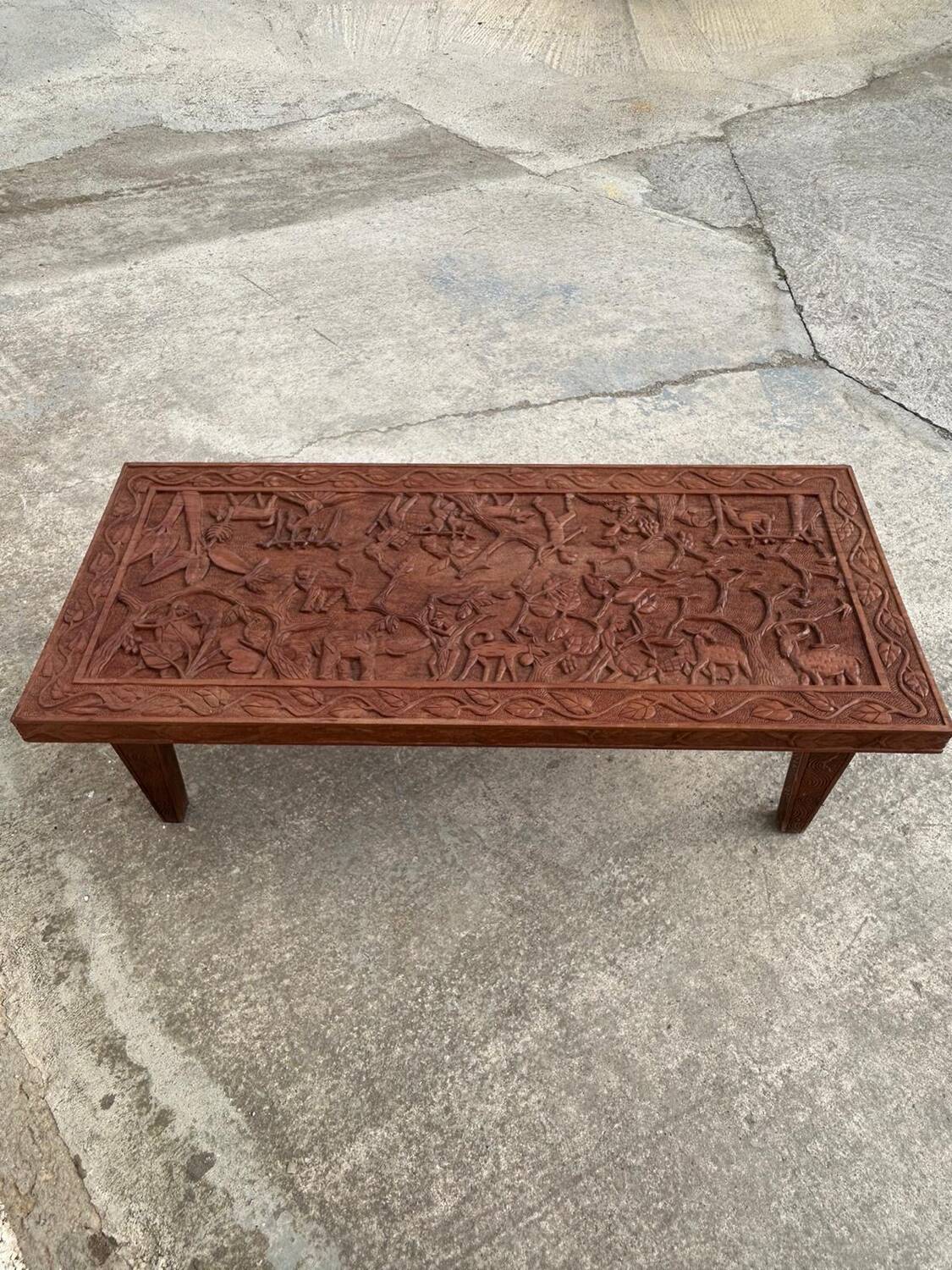 Afro style carved wooden table with glass top