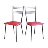 Pair of red Colette Guéden chairs