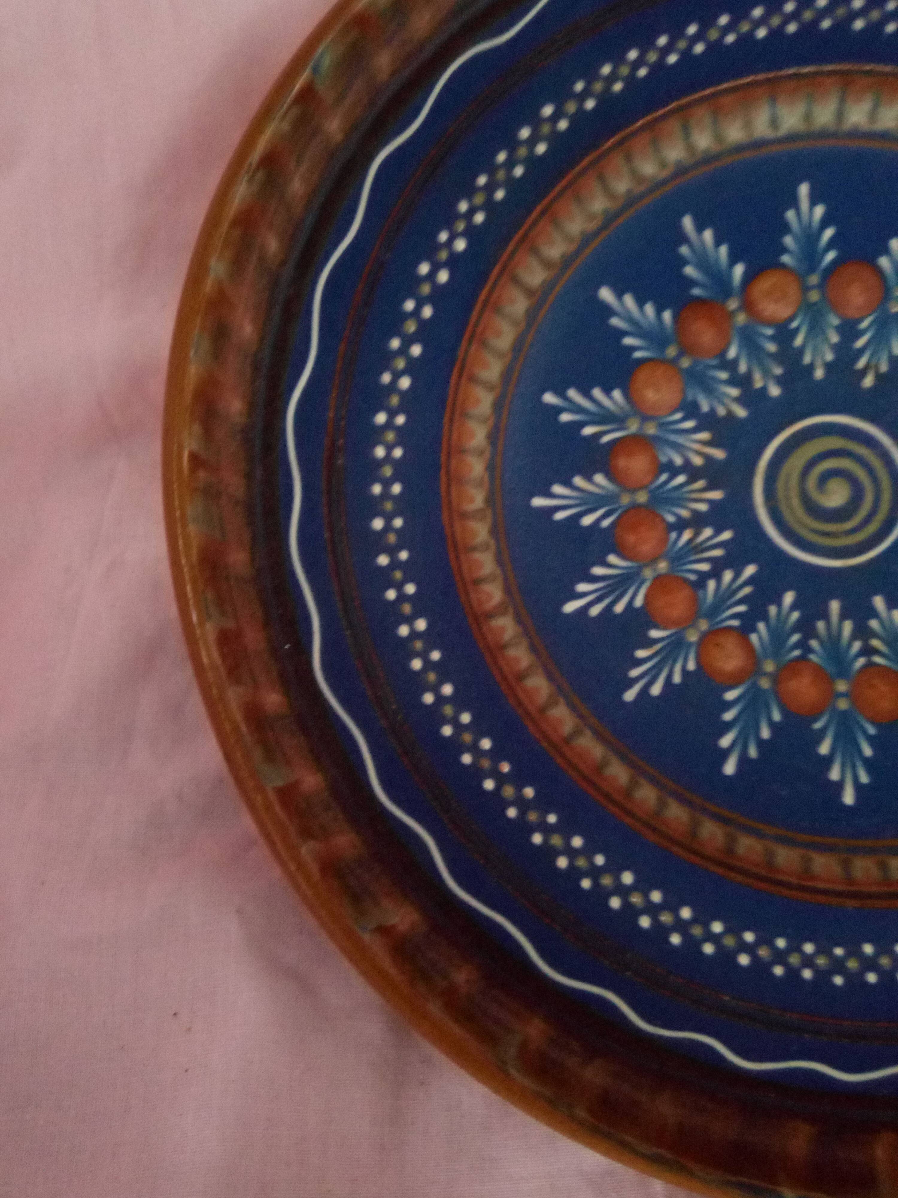 Plate in painted sandstone