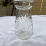 Small glass vase with leaf pattern.