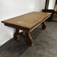 Renaissance-style oak dining table with lyre legs.