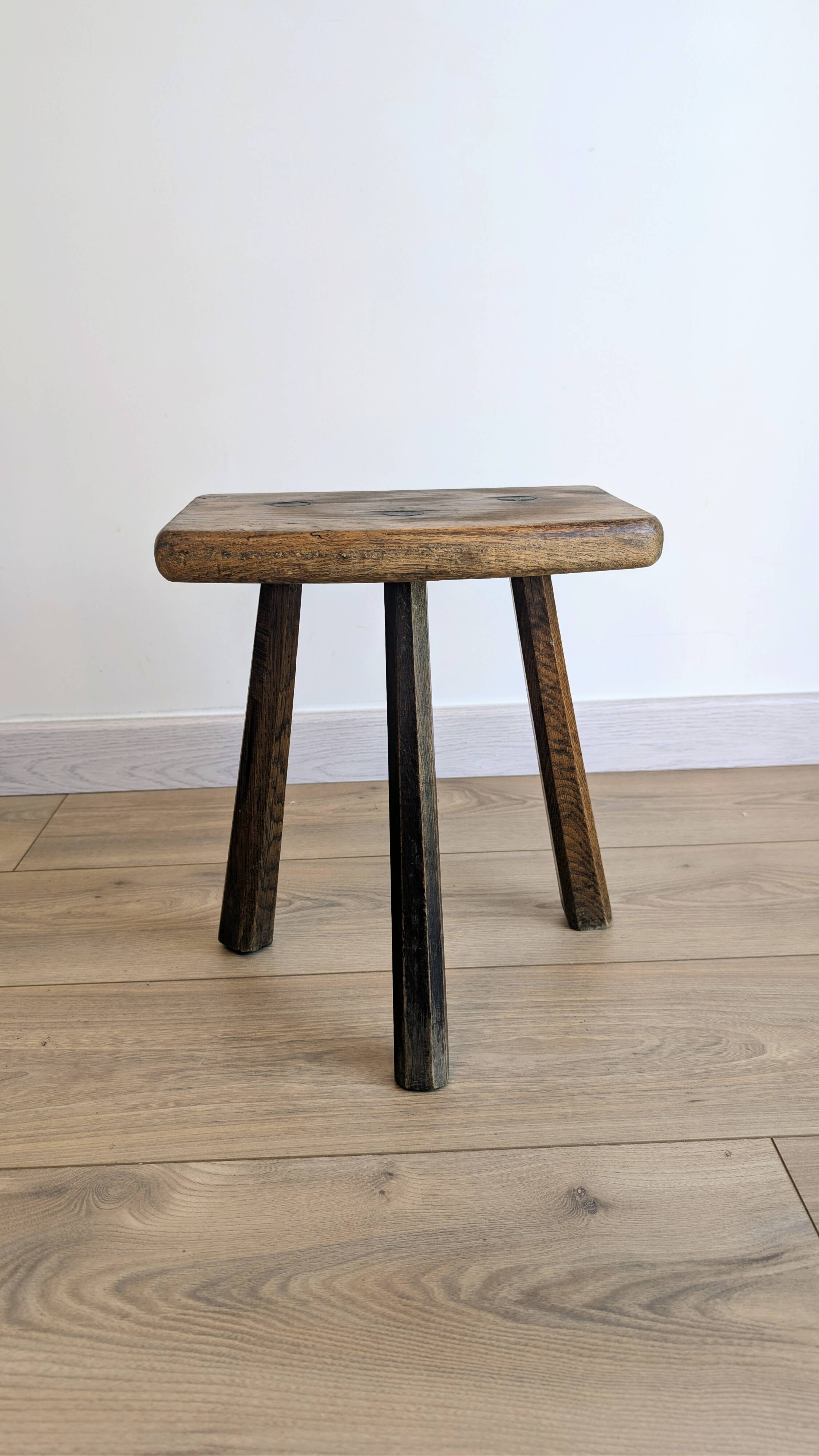 Antique tripod stool in patinated solid wood