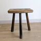 Antique tripod stool in patinated solid wood