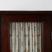 French Art Deco tall cabinet with glass door and hidden compartiment, ca. 1