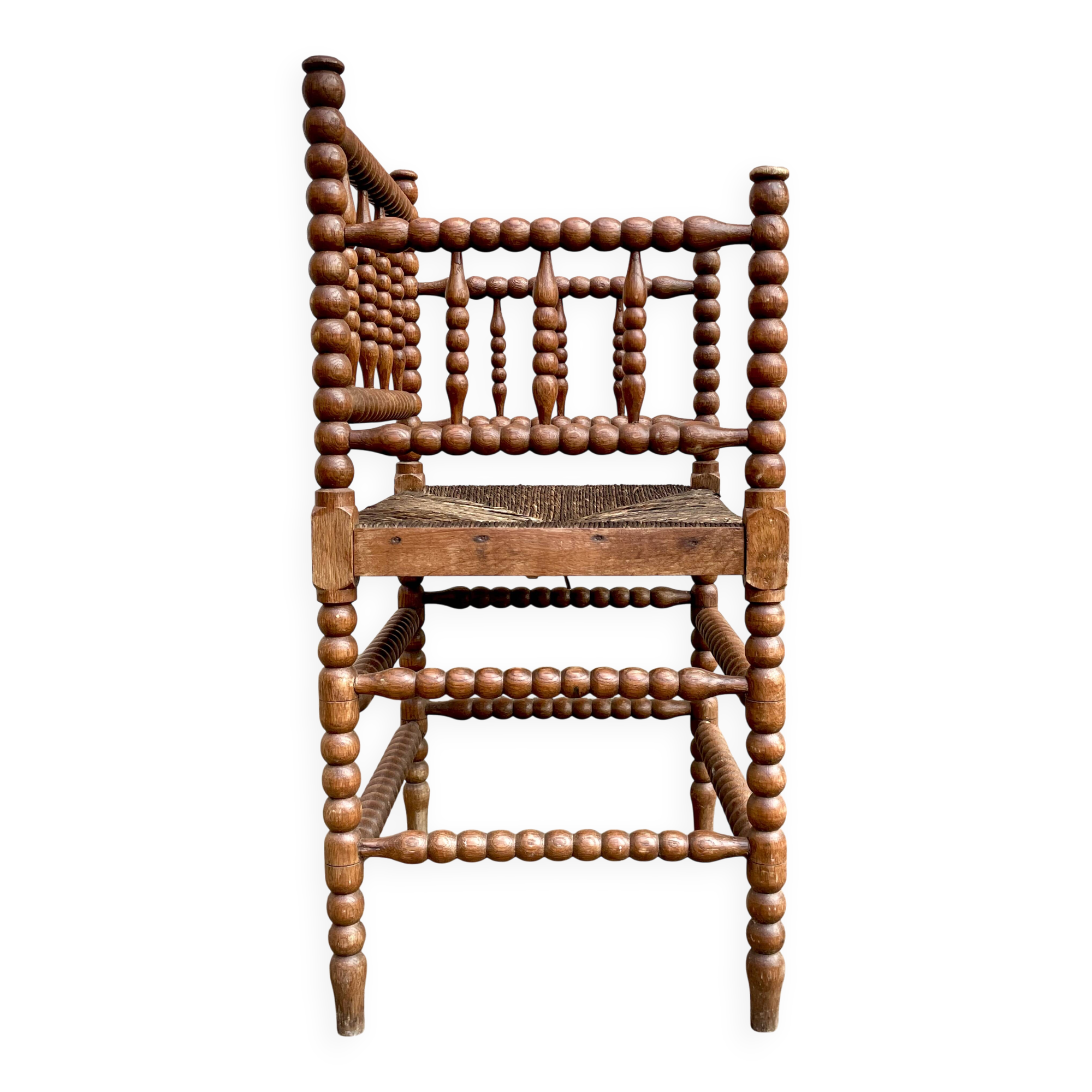 Antique Bobbin armchair with straw seat