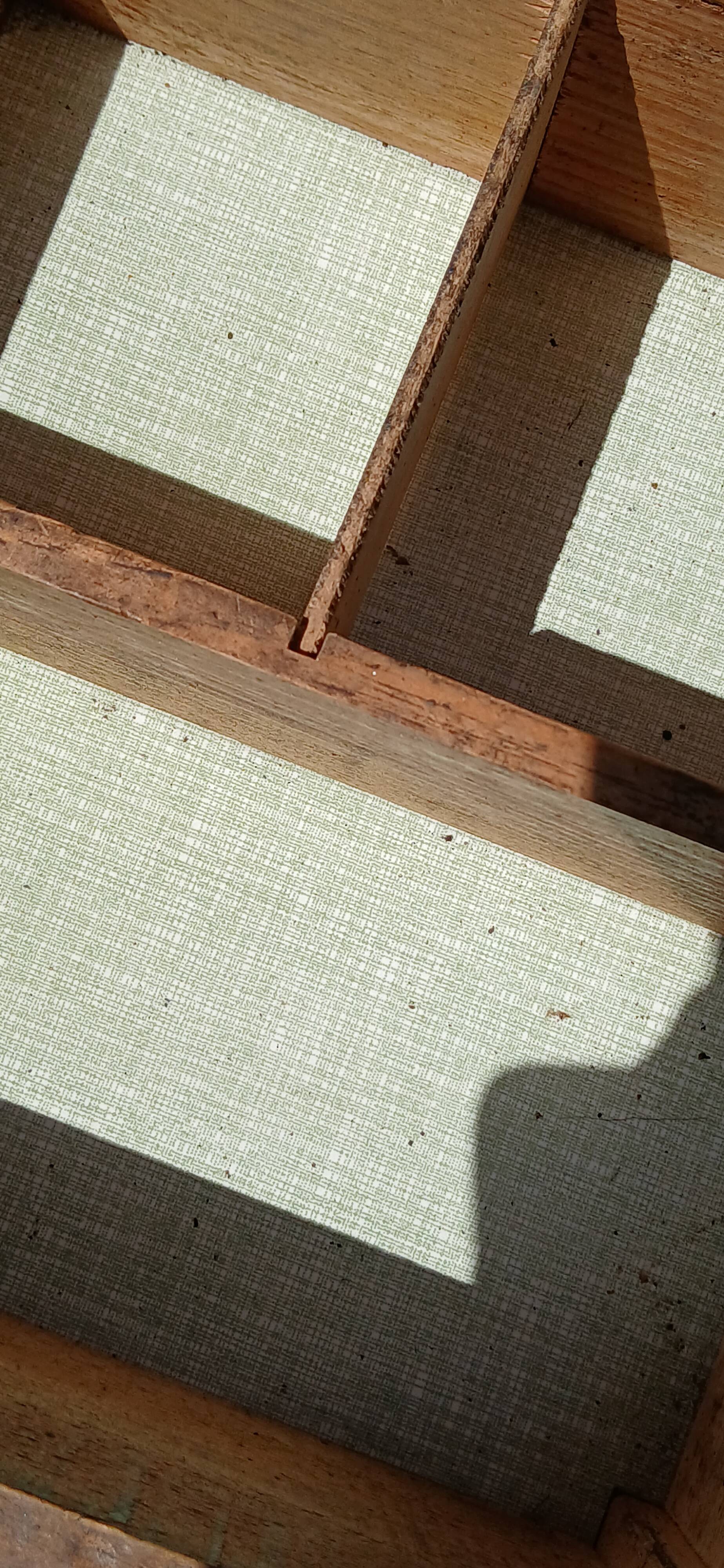 Shoe polish stool with round top and aluminum legs.