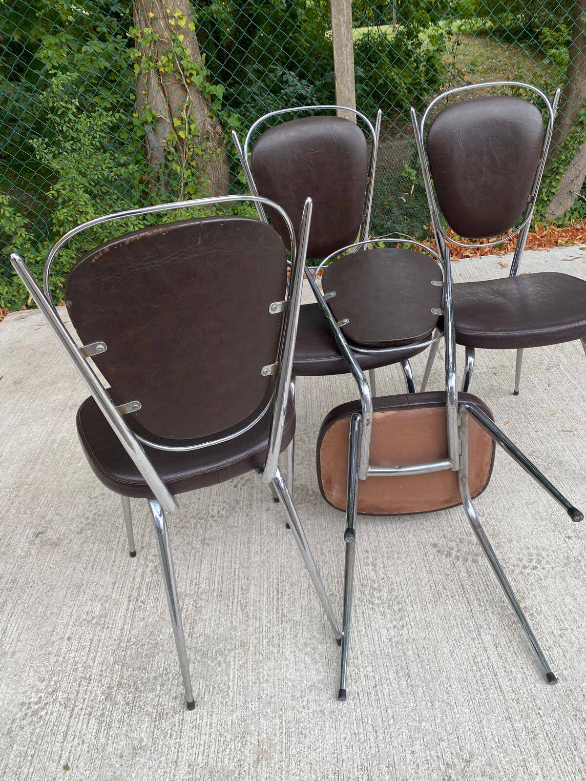 Set of 4 vintage chairs from the 60s/70s in brown faux leather with chrome compass legs.