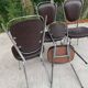 Set of 4 vintage chairs from the 60s/70s in brown faux leather with chrome compass legs.