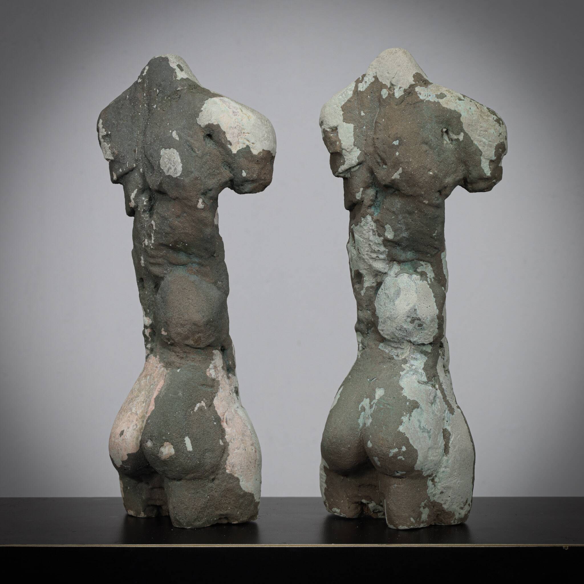 Pair of male torso sculptures by Francine Govers, 1990s