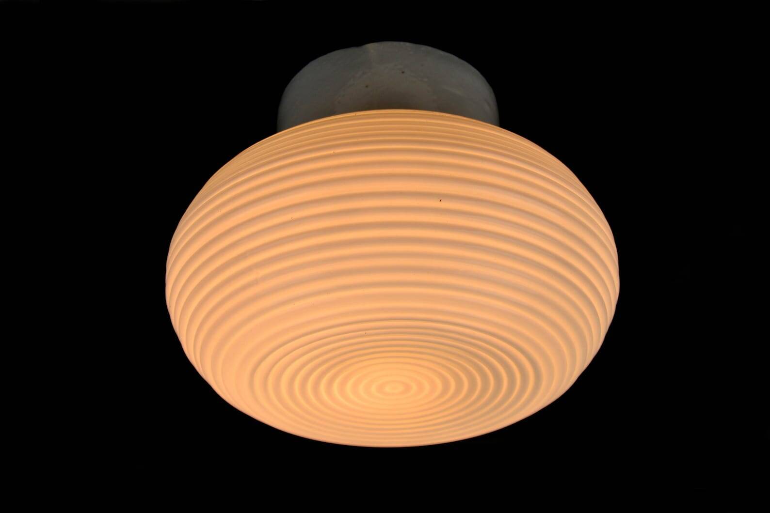 White glass spiral wall lamp by Polam Vikasy, Poland in the 1970s.