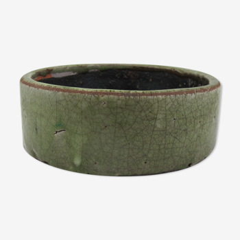 Bowl or empty pocket in cracked green sandstone varnish raku